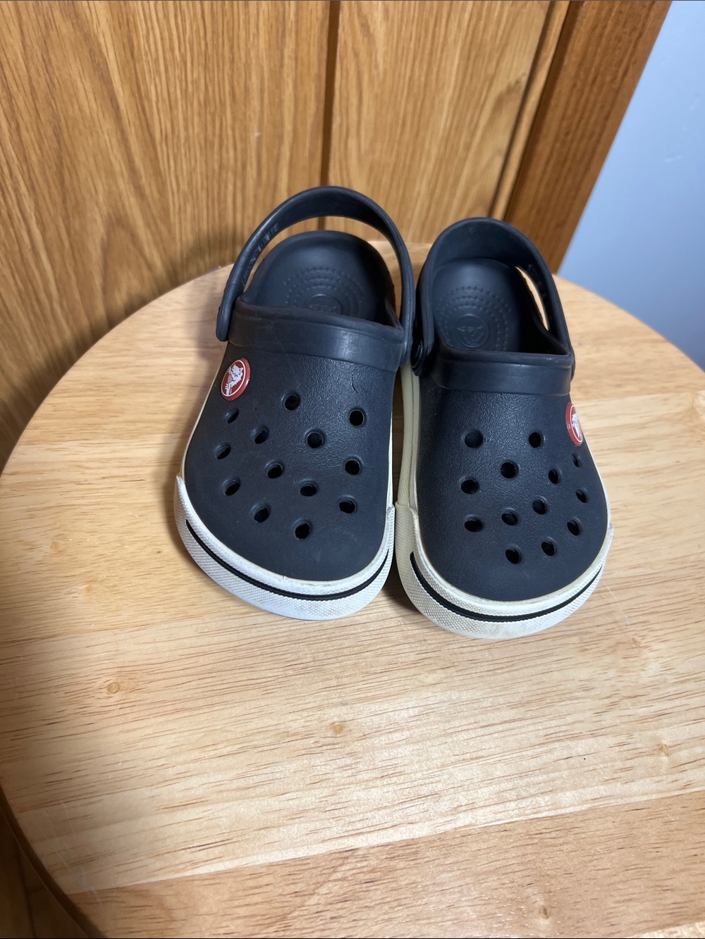 CROCS Kids Black Clogs with White Trim and Red Logo